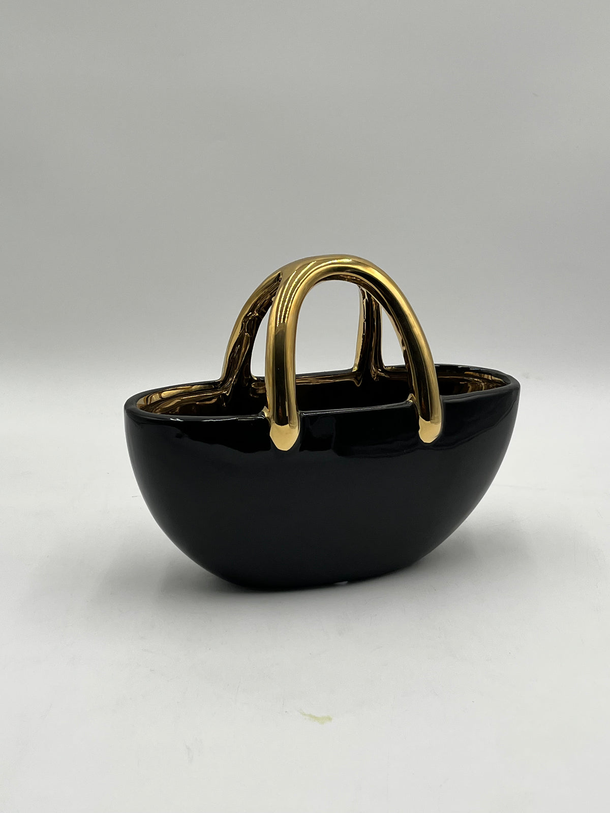 The Arcora series of vases are sculptural ceramic objects that transcends traditional form 7x8.5 Op, sold by floralsuppliespoint1.com