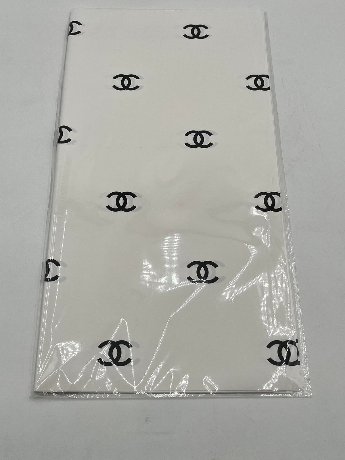 Paris Luxe CC Collection– in white/black, designer-inspired wrapping papers with gold & black logos. 20 sheet pack for $9.99 each by floralsuppliespoint1.com