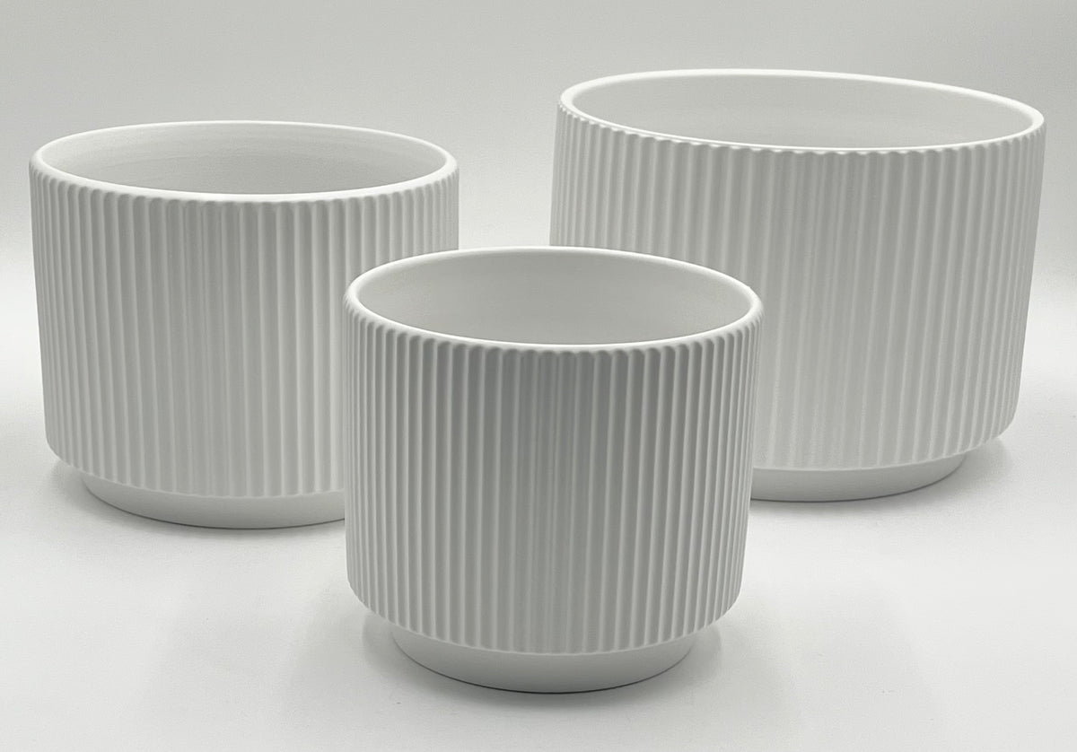 Ridge Nest Set of 3 ribbed ceramic vases in white with sizes 5.75x5.75", 6.25x7", and 7.25x9" (height x opening), total 11.80 lbs, available in black or white at floralsuppliespoint1.com.