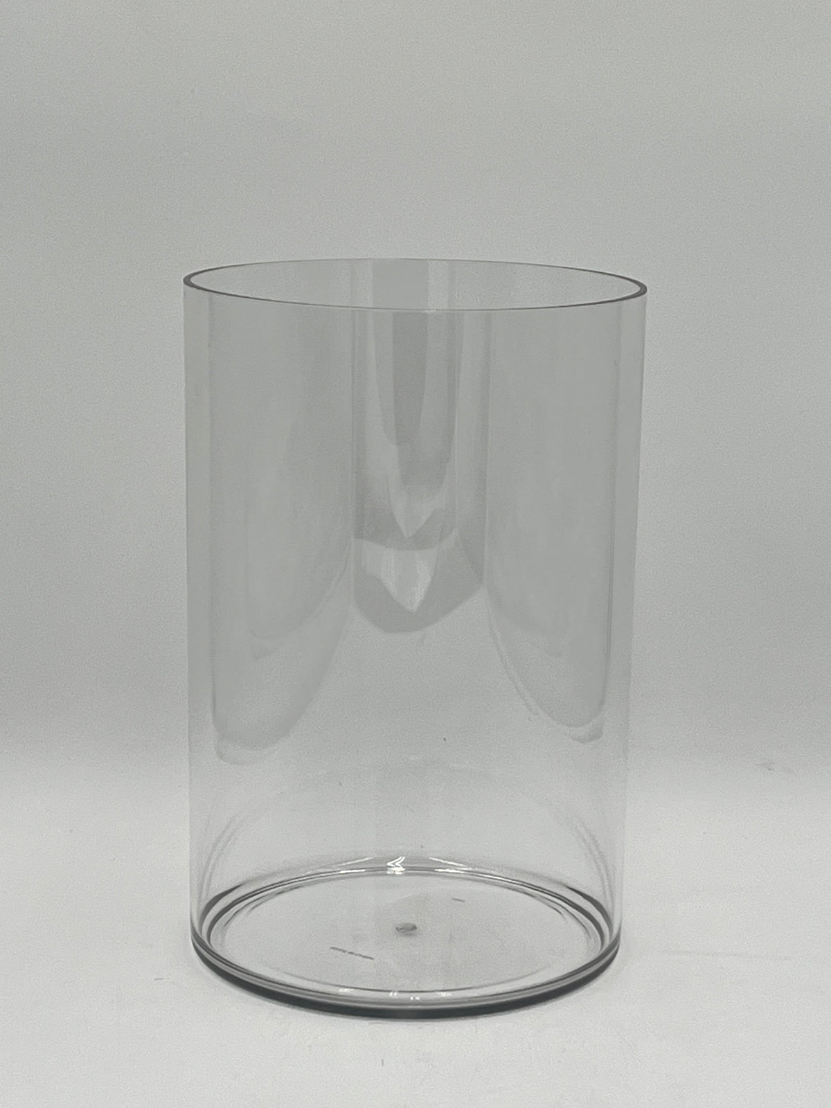 Clear plastic cylinder vases in four sizes for floral design, candles, or decor use. Lightweight and modern. Sold individually by floralsuppliespoint1.com.