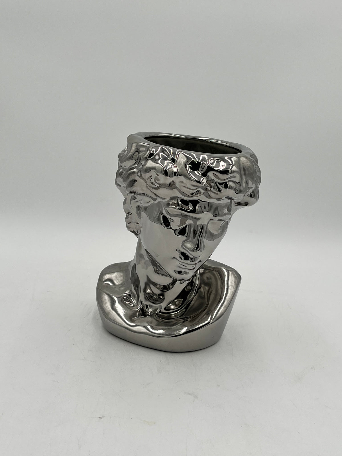 Silver ceramic bust vase with reflective finish, titled Apollo Gaze — modern artistic décor sold by floralsuppliespoint1.com $14.99