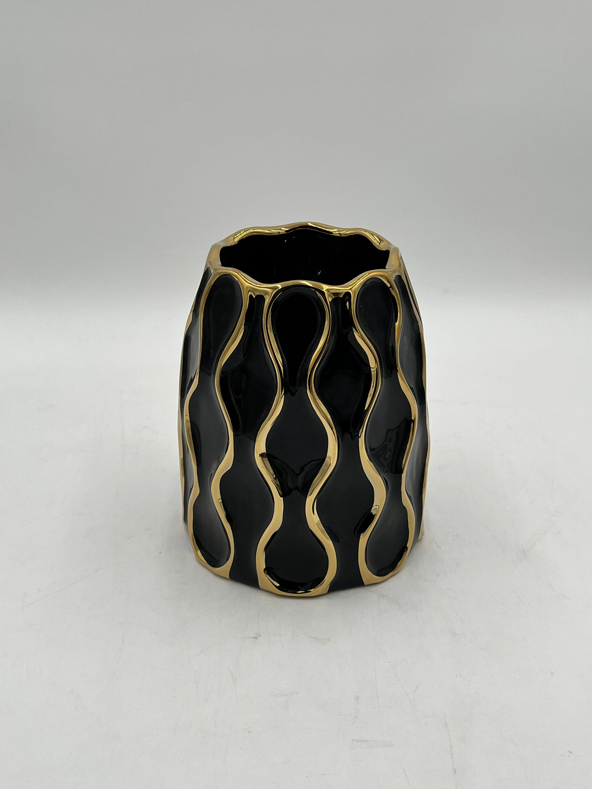 Auric Wave ceramic vases in black & white with gold wave detailing. Elegant décor accent pieces available in 5 sizes & sold by floralsuppliespoint1.com.