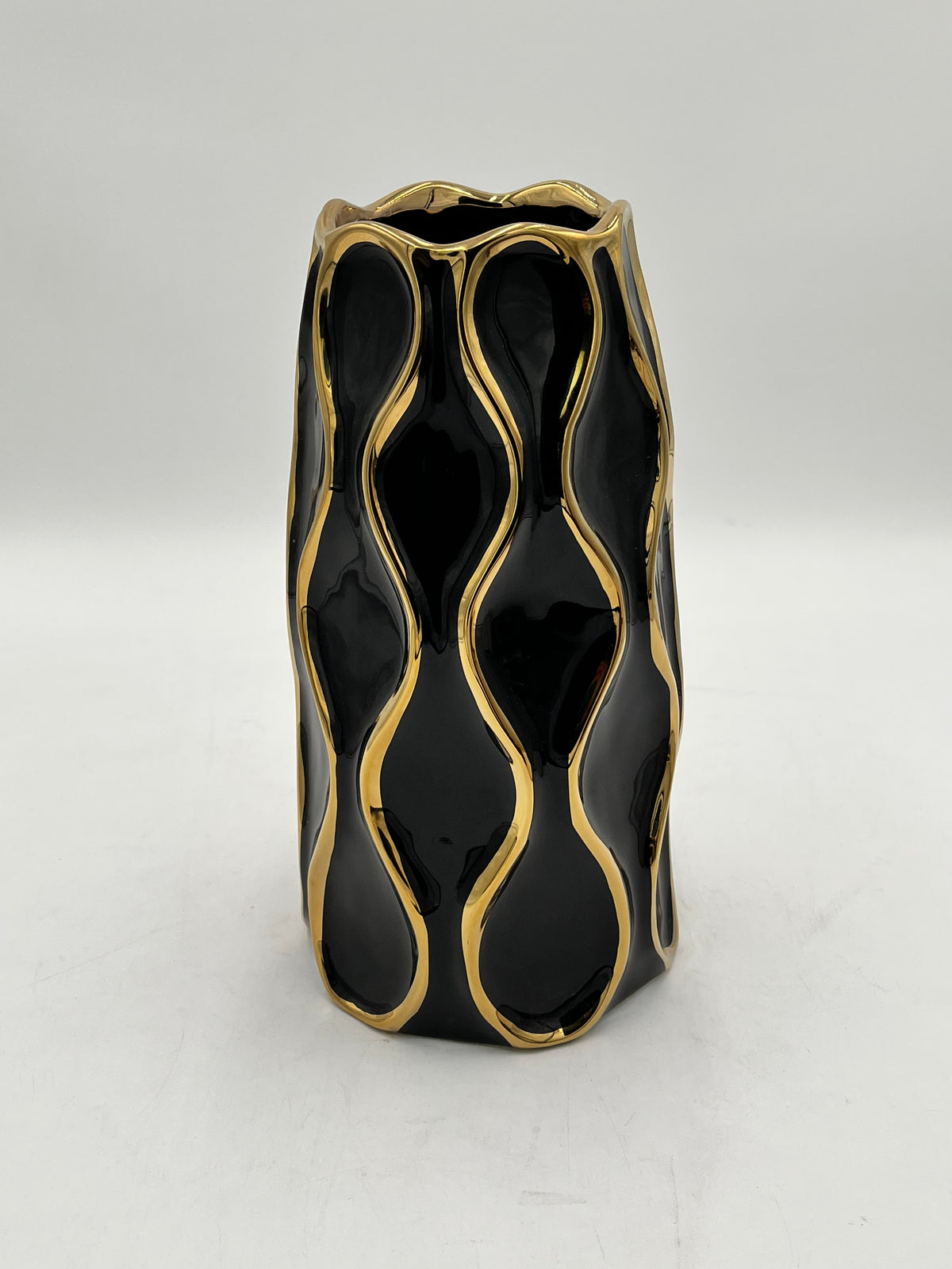 Auric Wave ceramic vases in black & white with gold wave detailing. Elegant décor accent pieces available in 5 sizes & sold by floralsuppliespoint1.com.