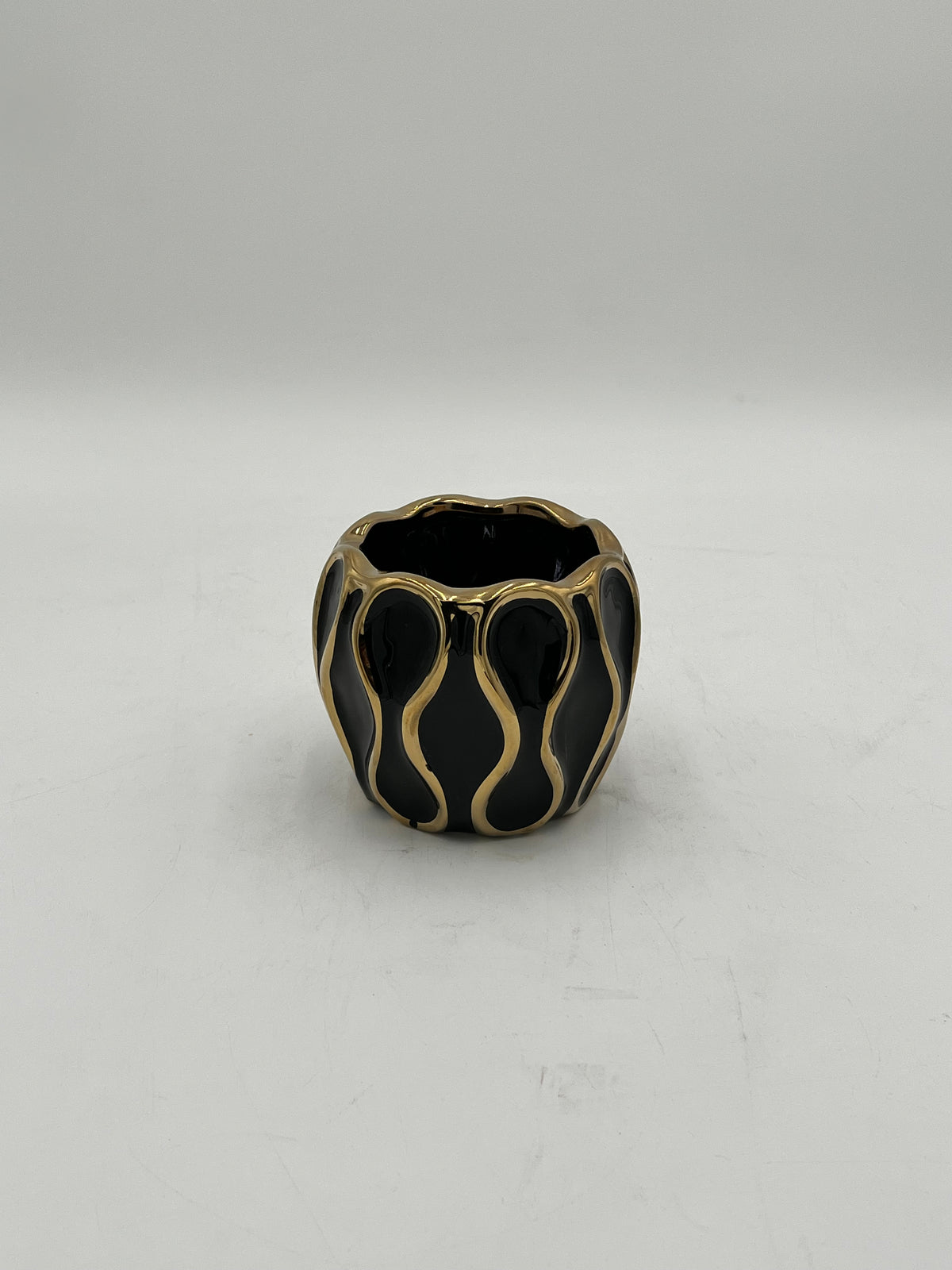 Auric Wave ceramic vases in black & white with gold wave detailing. Elegant décor accent pieces available in 5 sizes & sold by floralsuppliespoint1.com.