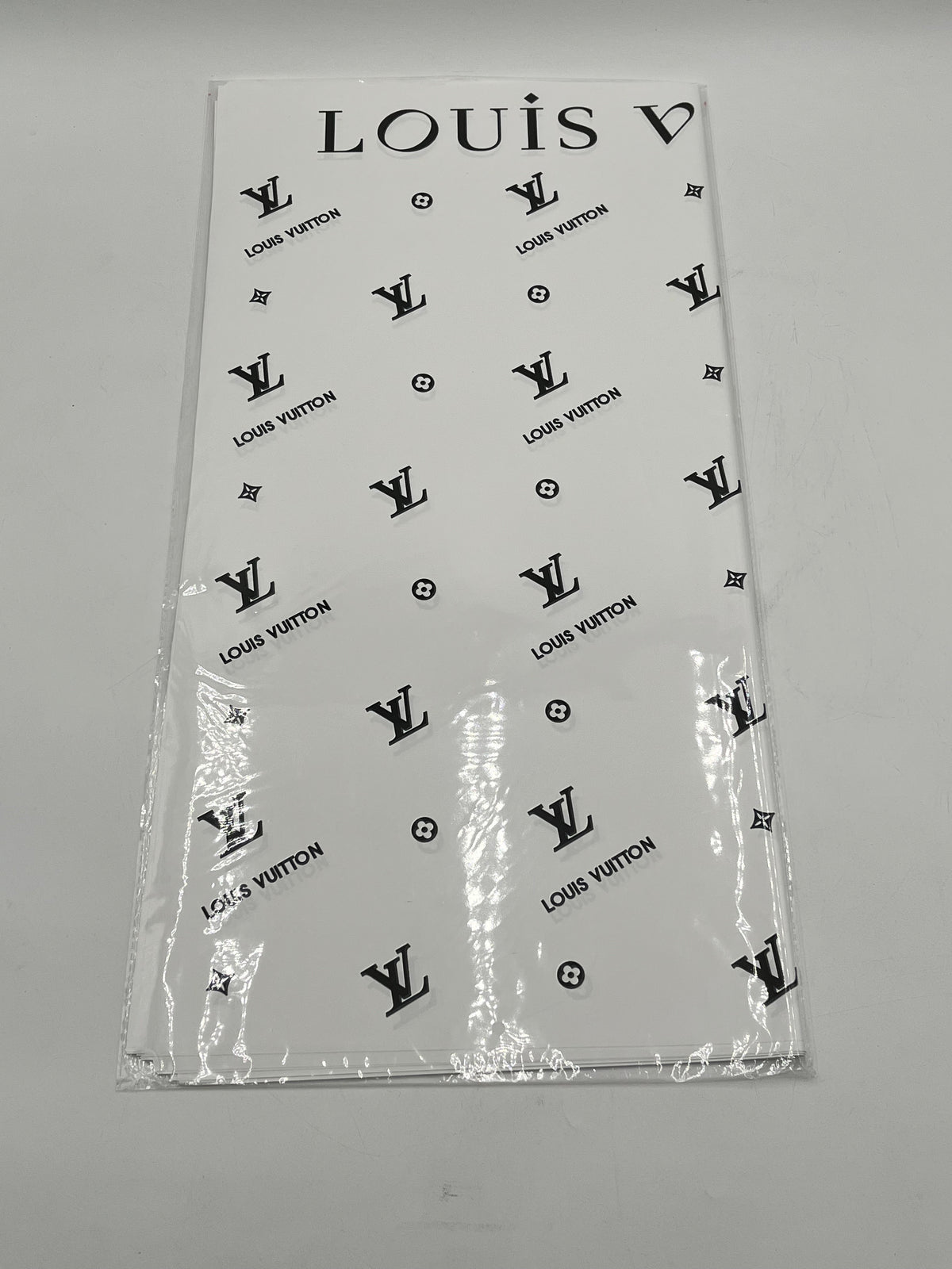 Enhance gifting with the Couture LV Collection. 20 luxury wrapping sheets (22x22) in white. $9.99 per pack, Sold by floralsuppliespoint1.com