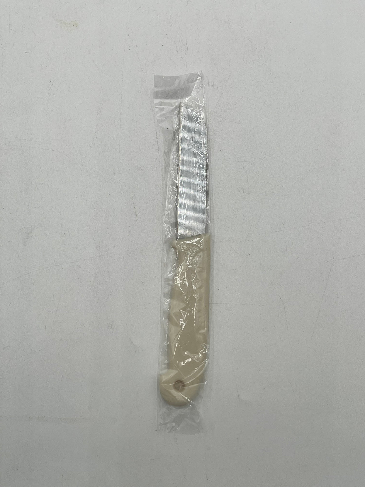 Craft & Floral Knife with beige handle, sold individually for $ .99, in packs of 10 or boxes by floralsuppliespoint1.com.