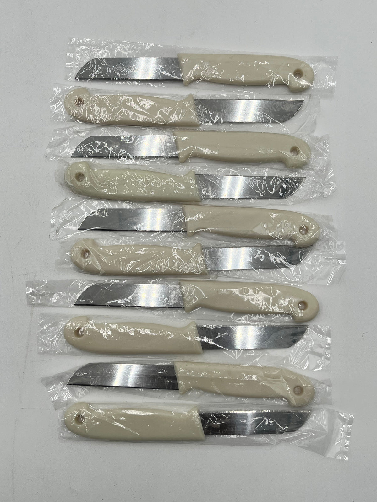 Craft & Floral Knives with a beige handle, sold in packs of 10 by floralsuppliespoint1.com.