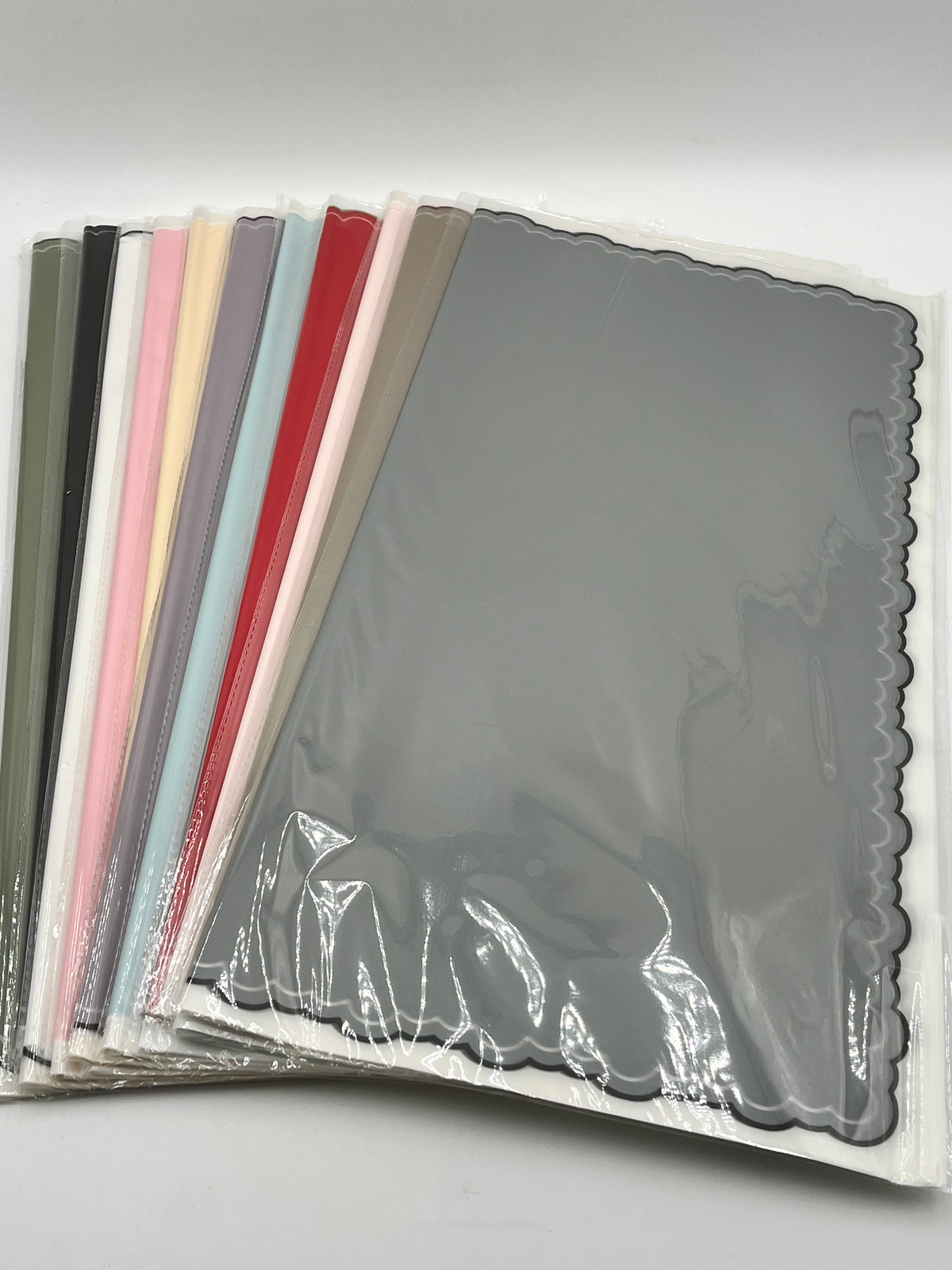 Elegant scalloped wrapping paper in 11 colors, 22 in x 22 in, packs of 20 for $9.99. Perfect for flowers, gifts & crafts, sold by floralsuppliespoint1.com