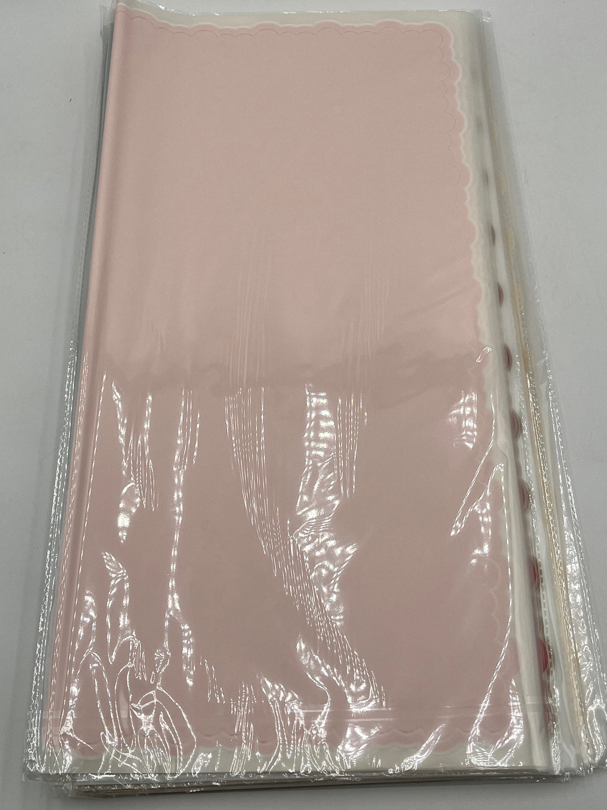 Light pink elegant scalloped wrapping paper, 22 in x 22 in, packs of 20 for $9.99. Perfect for flowers, gifts & crafts, sold by floralsuppliespoint1.com