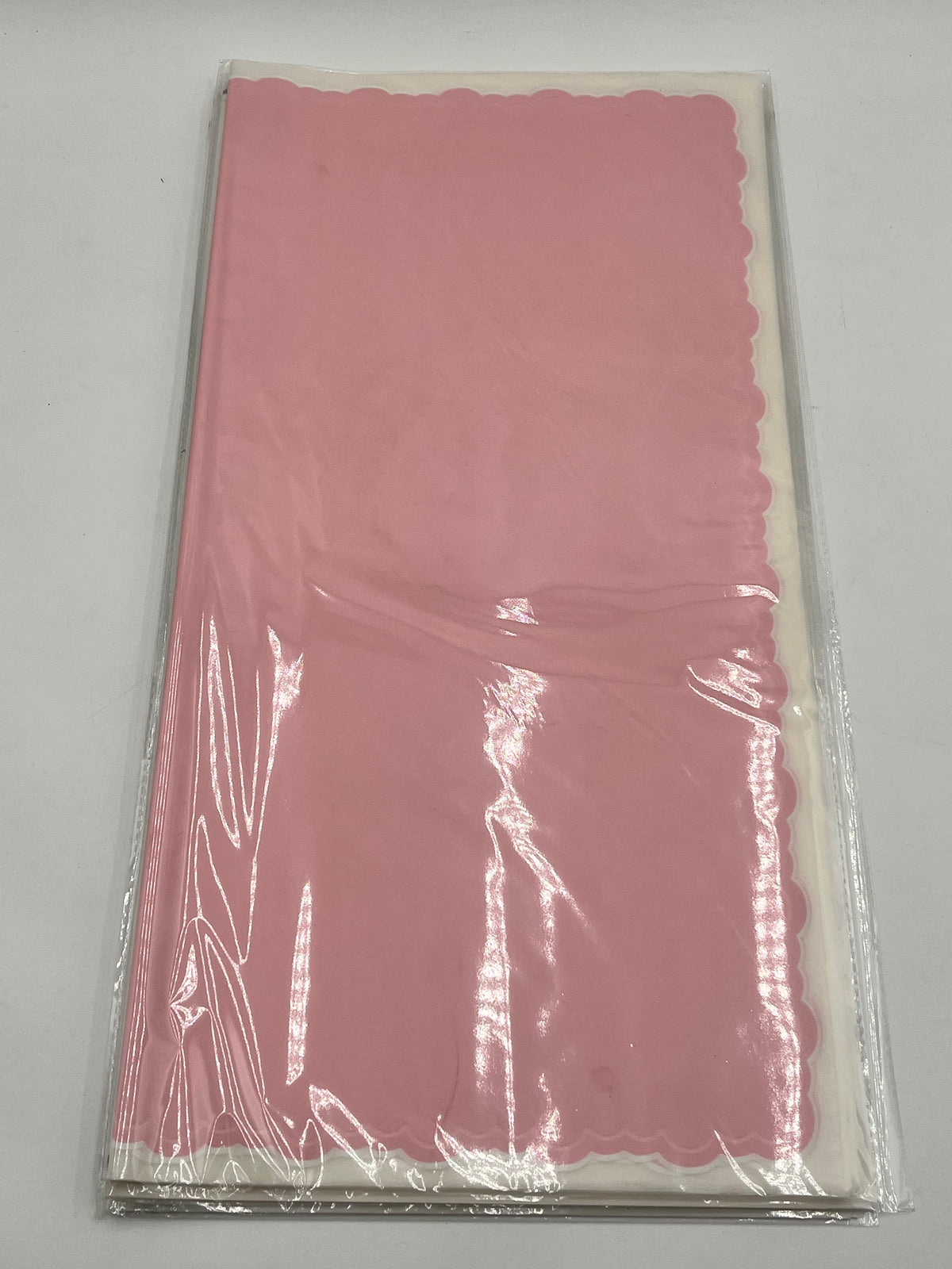 Pink elegant scalloped wrapping paper, 22 in x 22 in, packs of 20 for $9.99. Perfect for flowers, gifts & crafts, sold by floralsuppliespoint1.com