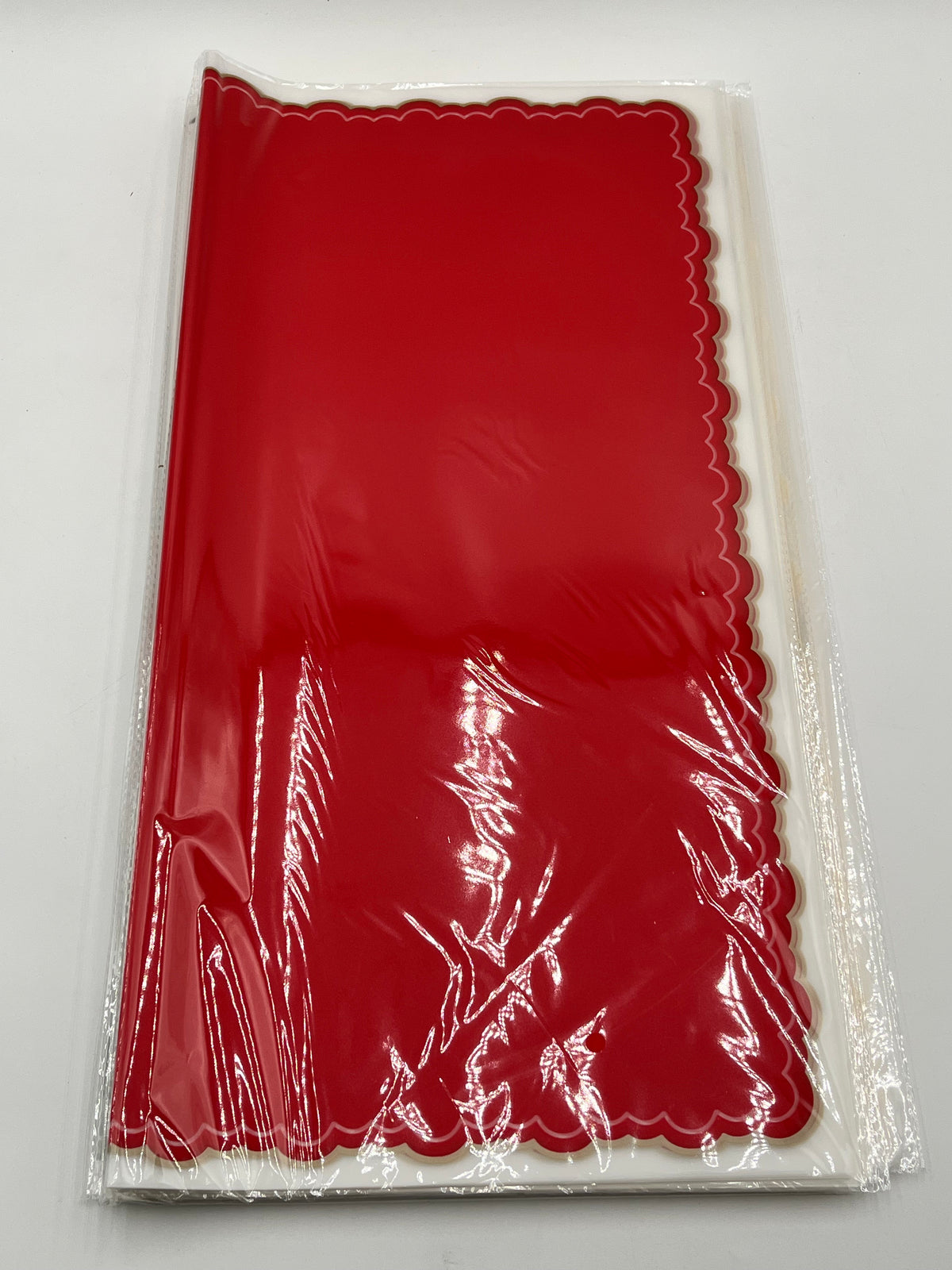 Red elegant scalloped wrapping paper, 22 in x 22 in, packs of 20 for $9.99. Perfect for flowers, gifts & crafts, sold by floralsuppliespoint1.com