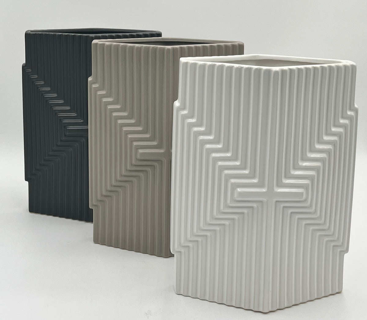 Eternal Grace Matte Edition ceramic vases in matte black, grey, and white with raised cross pattern, sold by floralsuppliespoint1.com for elegant floral tributes or modern decor.