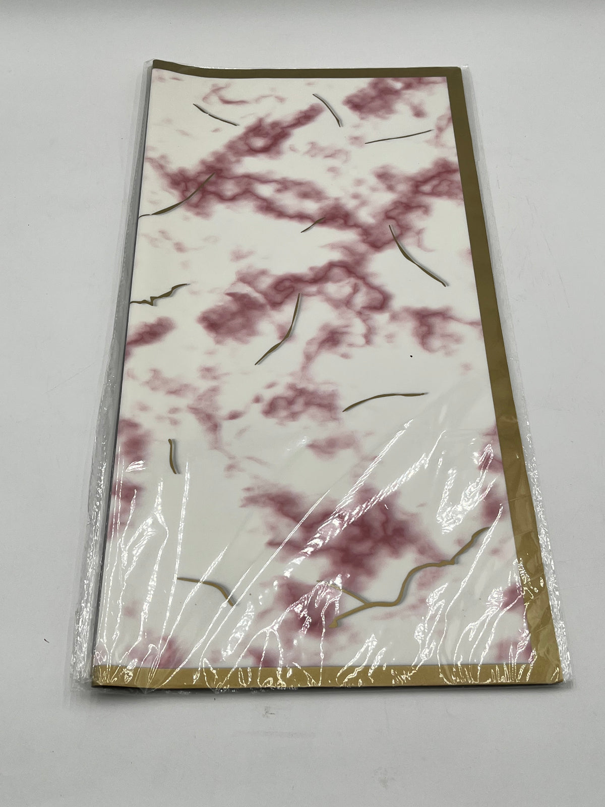 Gilded Marble Vein Trio 22x22 inch (20 sheets) wrapping papers in White with Red Veins. Sold by floralsuppliespoint1.com for $9.99.

