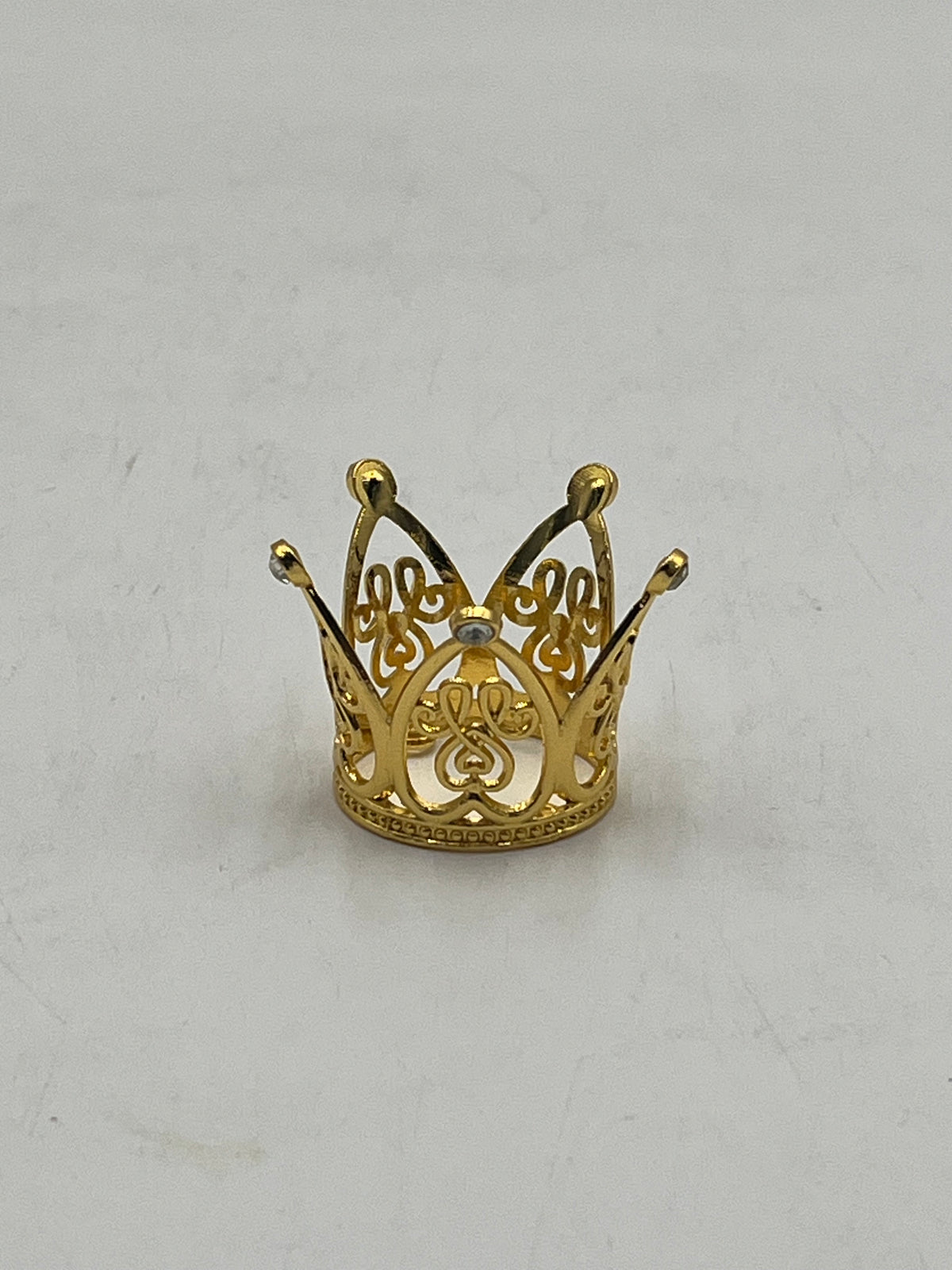 Mini gold crown for floral arrangements, cakes, and party favors. Perfect for weddings, showers & crafts. Sold individually or wholesale by floralsuppliespoint1.com