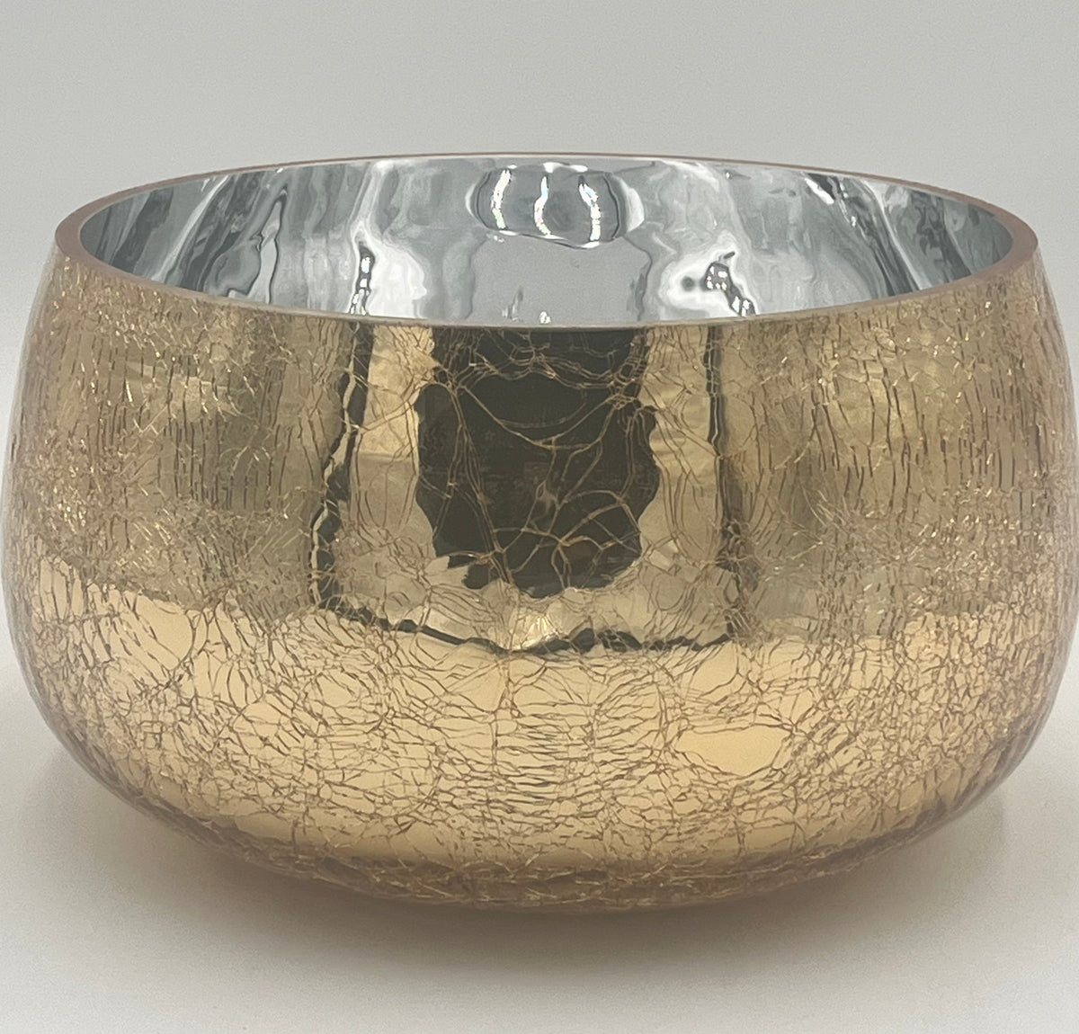 The Golden Craquelure 5.75x8.5 Op by Floral Supplies Point features a round metallic bowl with a gold craquelure finish and a reflective silver interior, embodying modern elegance against a plain white background.