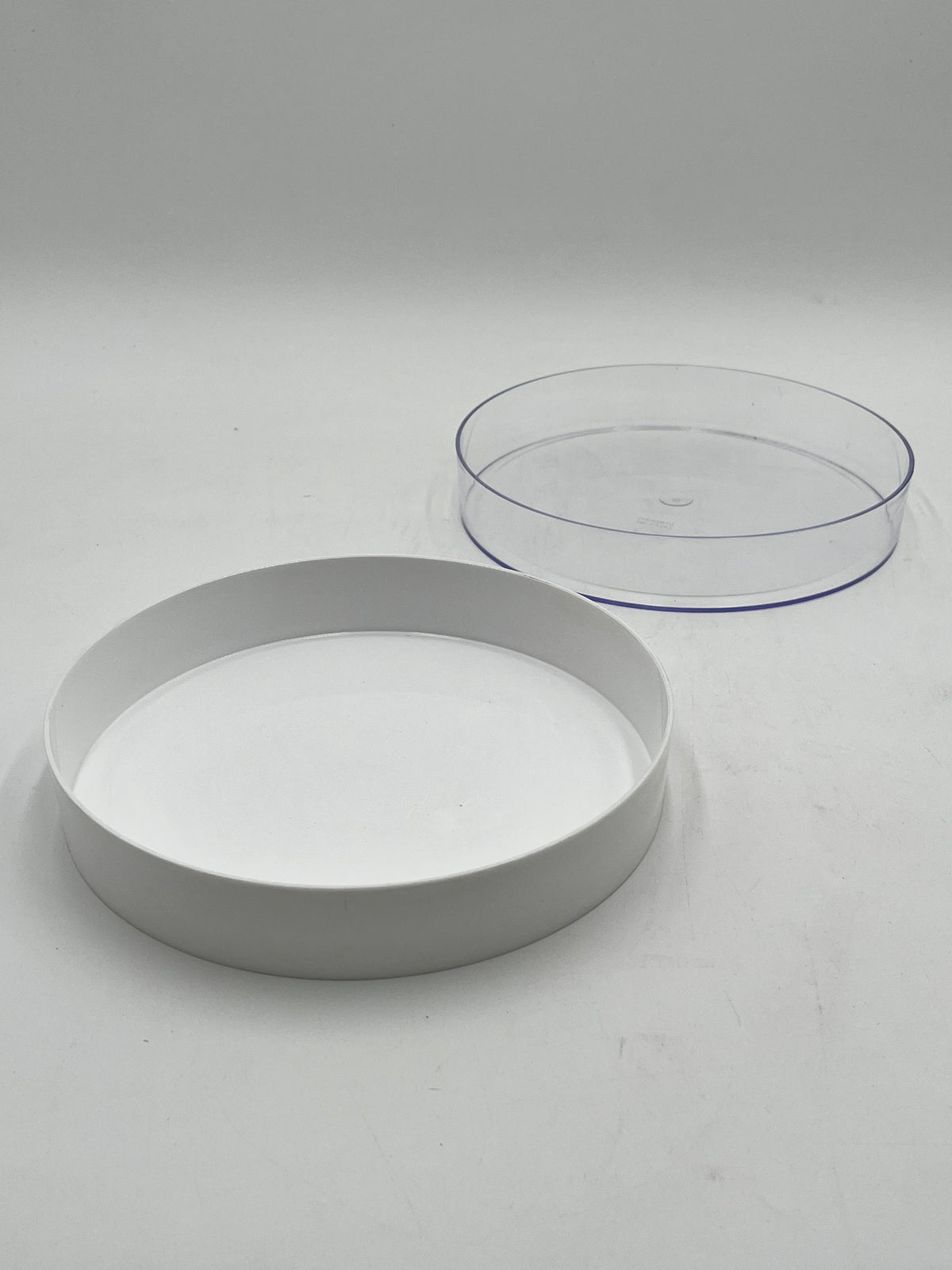 9” round floral tray,1.5” deep in white & clear. Durable, stylish, ideal for events, perfect for foam-based fresh or artificial flowers. Sold by floralsuppliespoint1.com