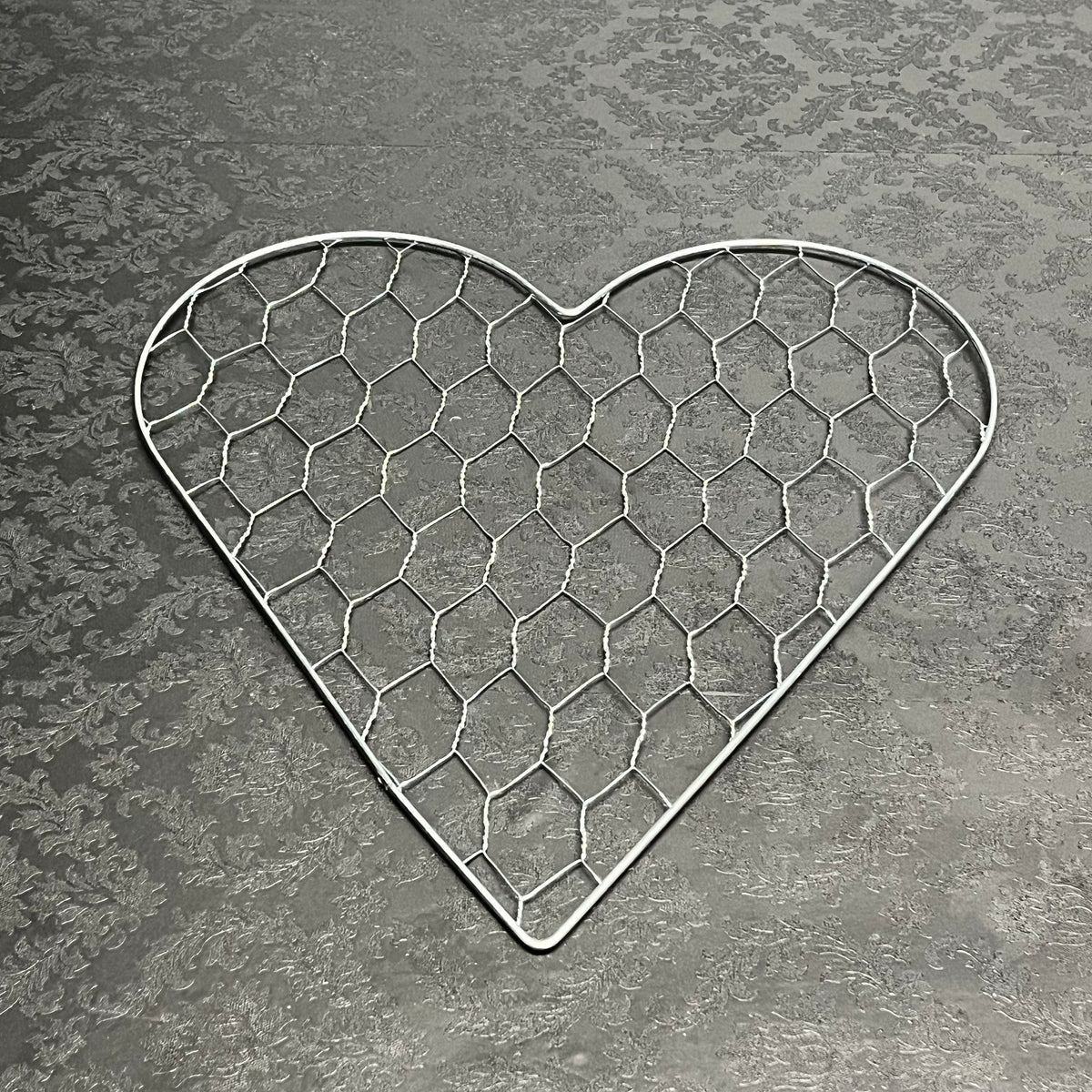 A heart of Haven wire mesh frame in medium size for floral design, sold for $11.99 by floralsuppliespoint1.com
