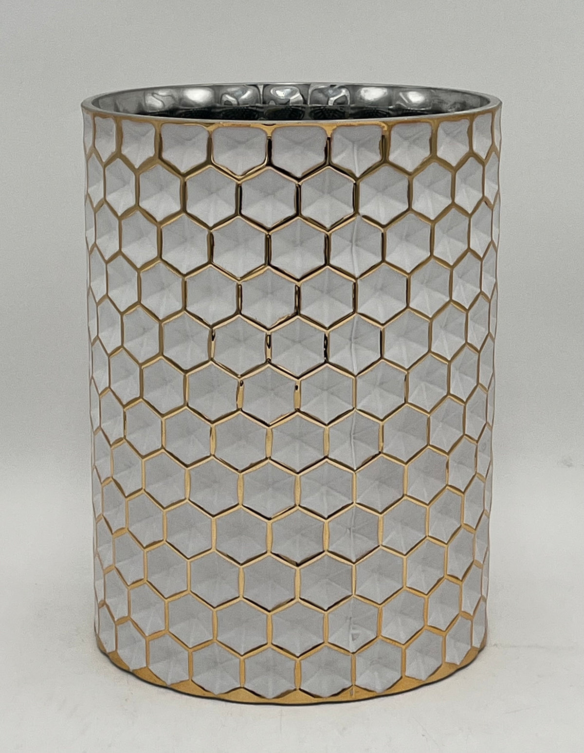 The Hexara Column 9.5x6.5 Op by Floral supplies Point is a cylindrical silver column with a modern honeycomb relief pattern outlined in gold, displayed on a plain white background.