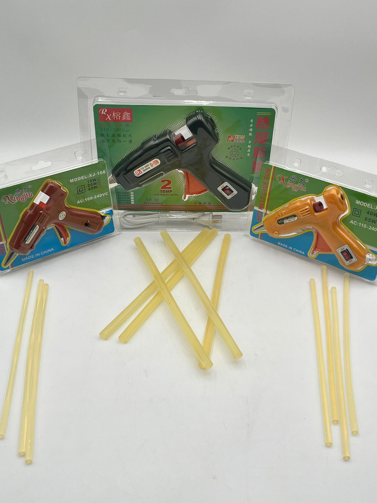 Hot glue guns with yellow glue sticks for floral arrangements, crafts and DIY projects. Sold by floralsuppliespoint1.com