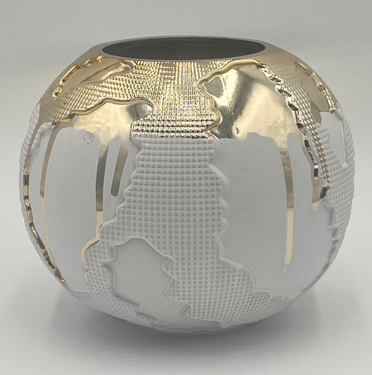 The Auralis Terra 6.5x3.5 Op by Floral Supplies Point is a round white vase featuring raised continents and shimmering gold accents, creating a stylish sculptural tribute to the world’s beauty.