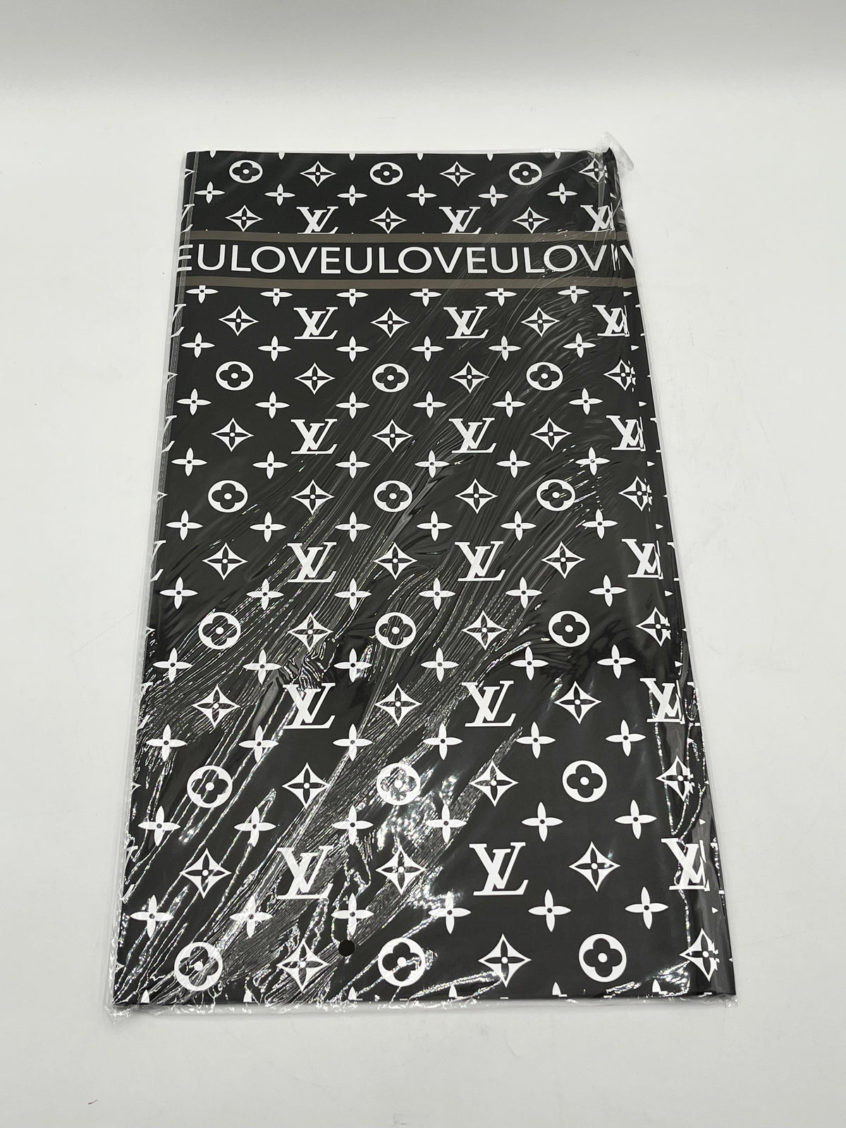 LOVEU LV Luxe Set wrapping paper in Black with iconic LV monogram. 20 sheets of 22"x22", Sold by floralsuppliespoint1.com for $9.99
