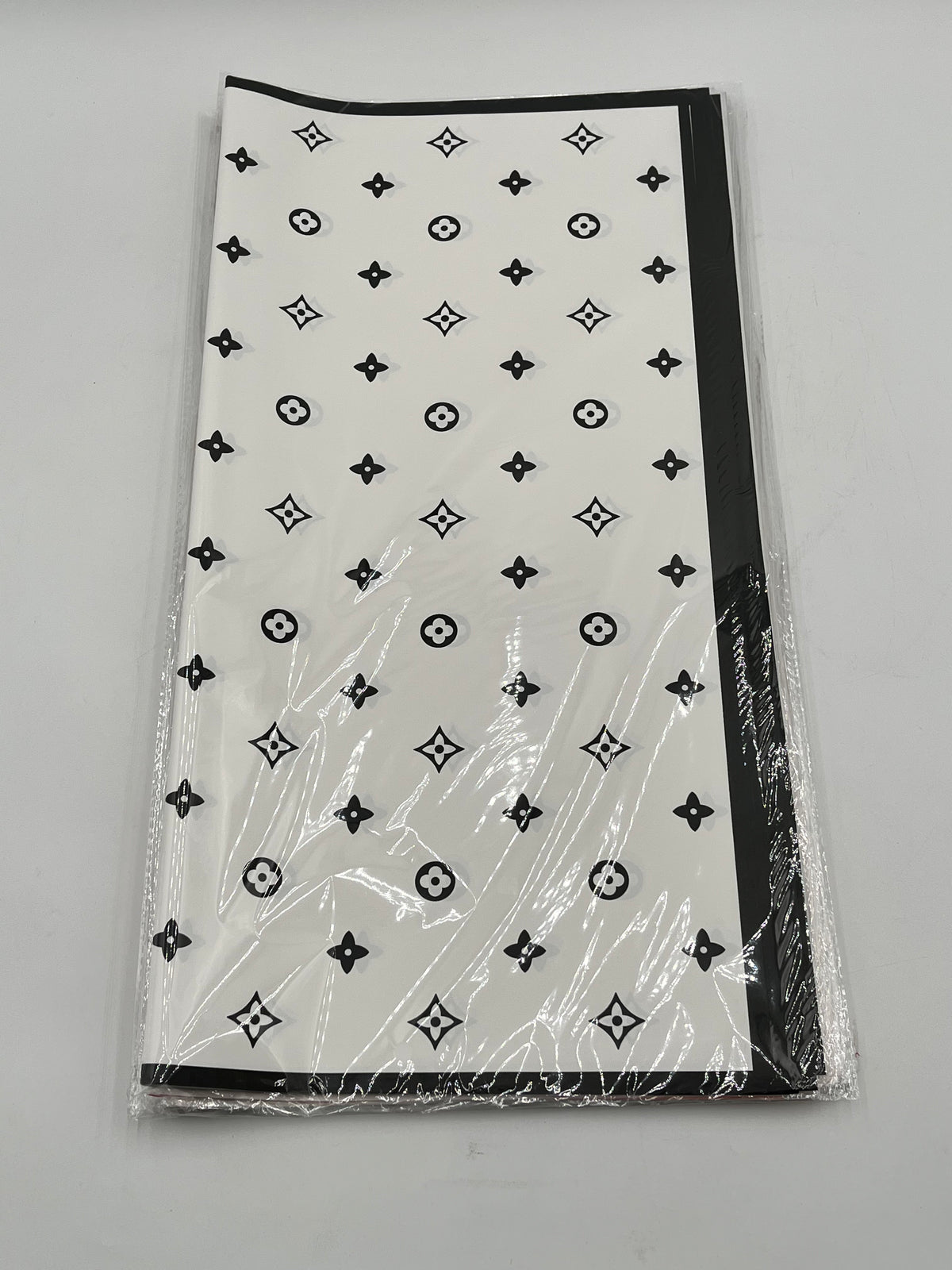 LV Luxe Monogram Edition wrapping sheets in White, 22x22" (20 sheets) for floral & gift use. Sold by floralsuppliespoint1.com for $9.99