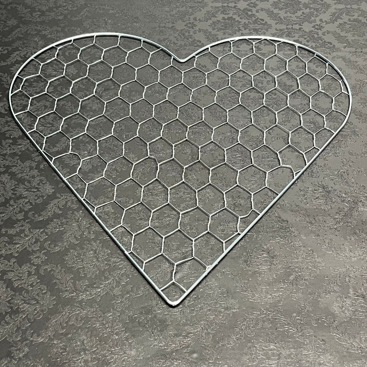 A ♡ of Haven wire heart frame in large size for floral design, sold for $13.99 by floralsuppliespoint1.com.