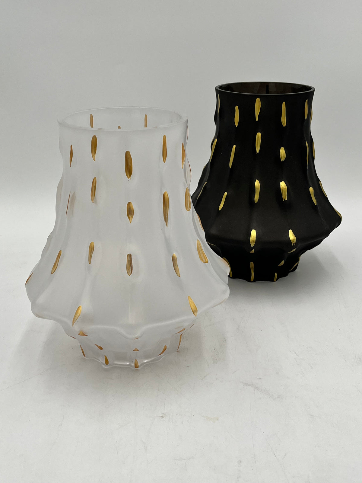 Midnight Ember Set showcase a dramatic & sculptural silhouette in matte white or black, providing a sophisticated, modern backdrop for the decorative accents.