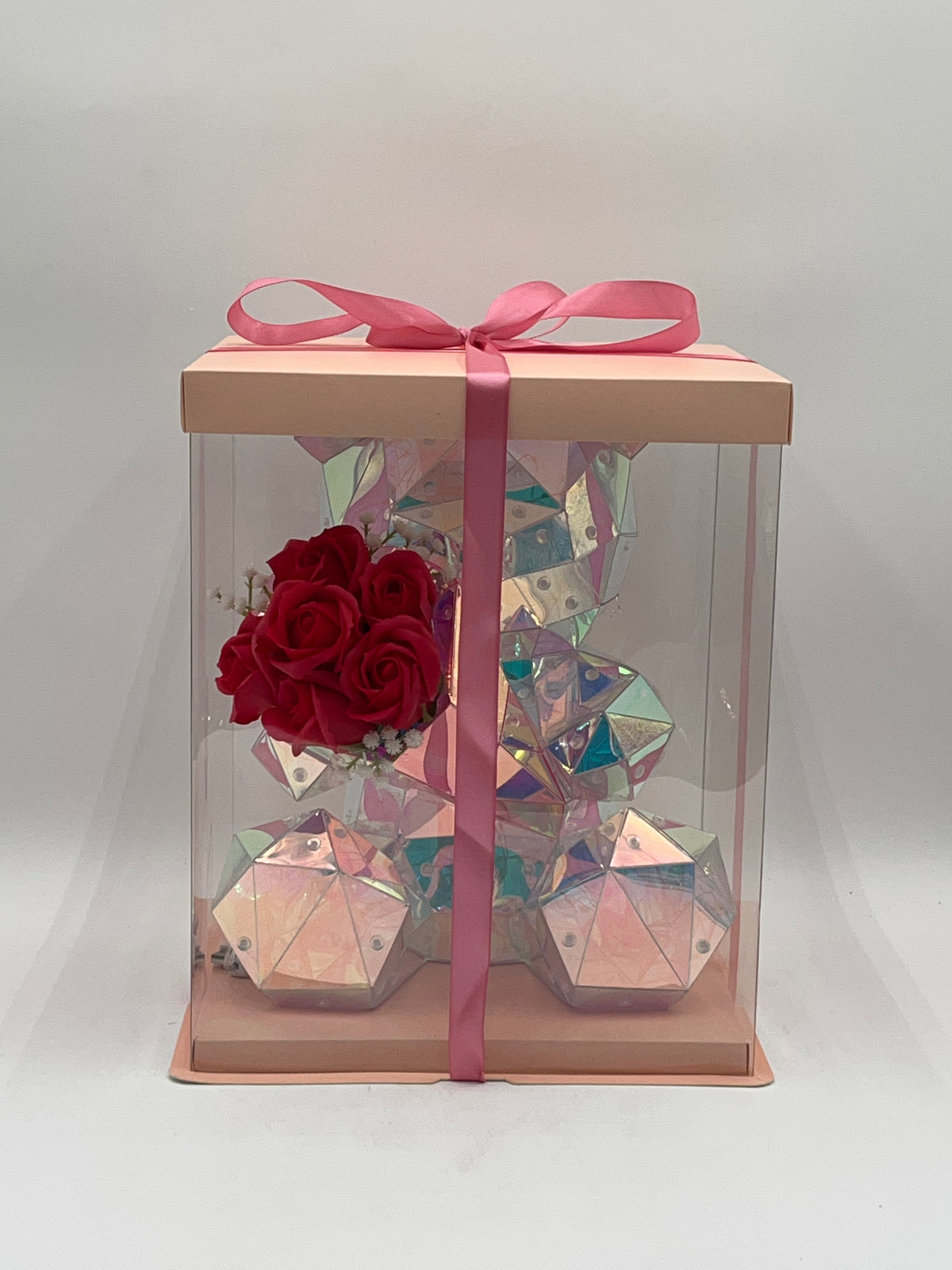 Iridescent light-up Rose Crystal Bear with red roses, USB cable, and pink gift box. Sold by floralsuppliespoint1.com for Individual  $34.99 retail or $160 wholesale for 8-count case.