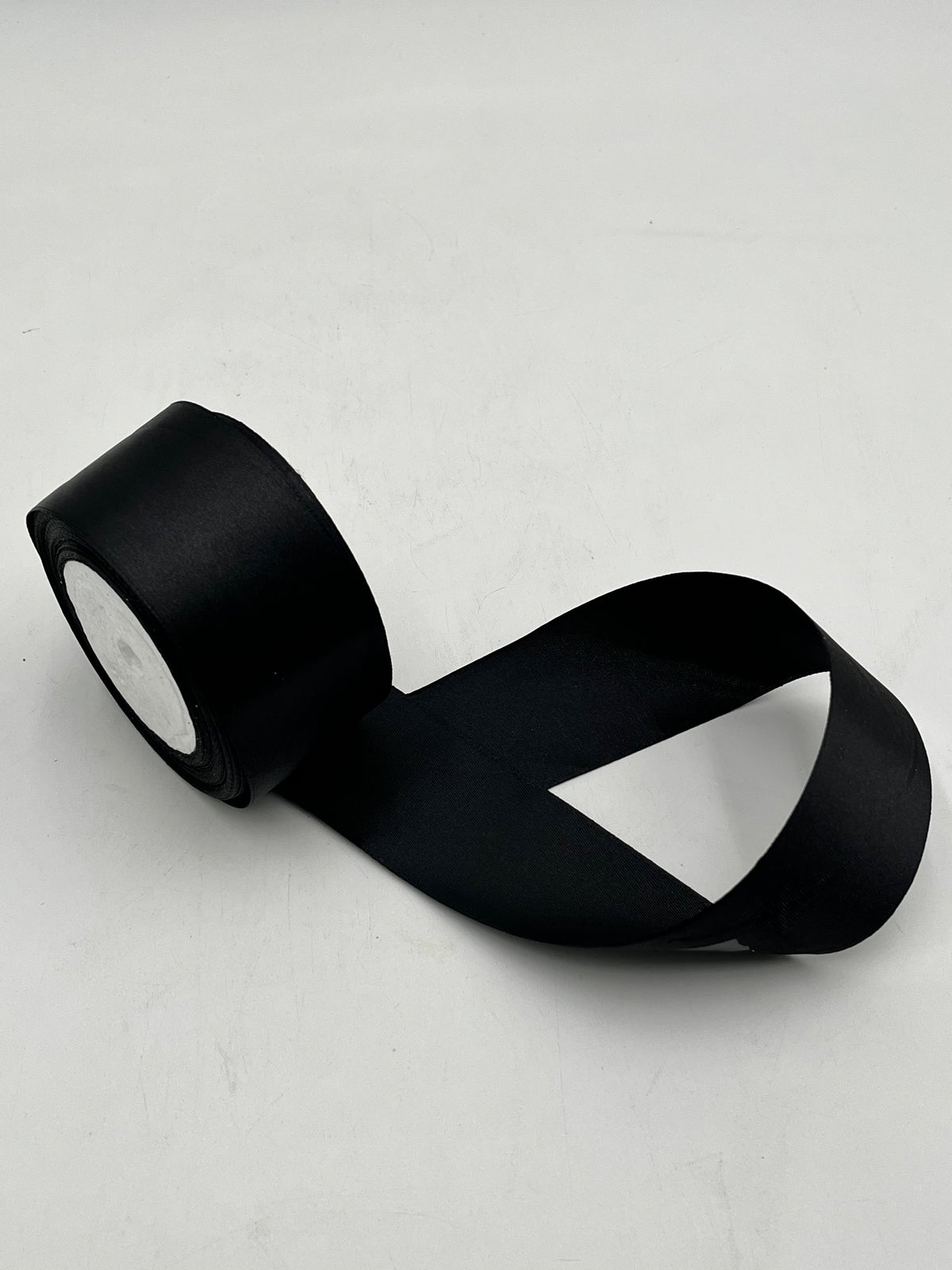 Satin ribbon rolls 1.5" & 2" x 25 yards in Red, Pink, White & Black. Sold individually or in packs by floralsuppliespoint1.com.
