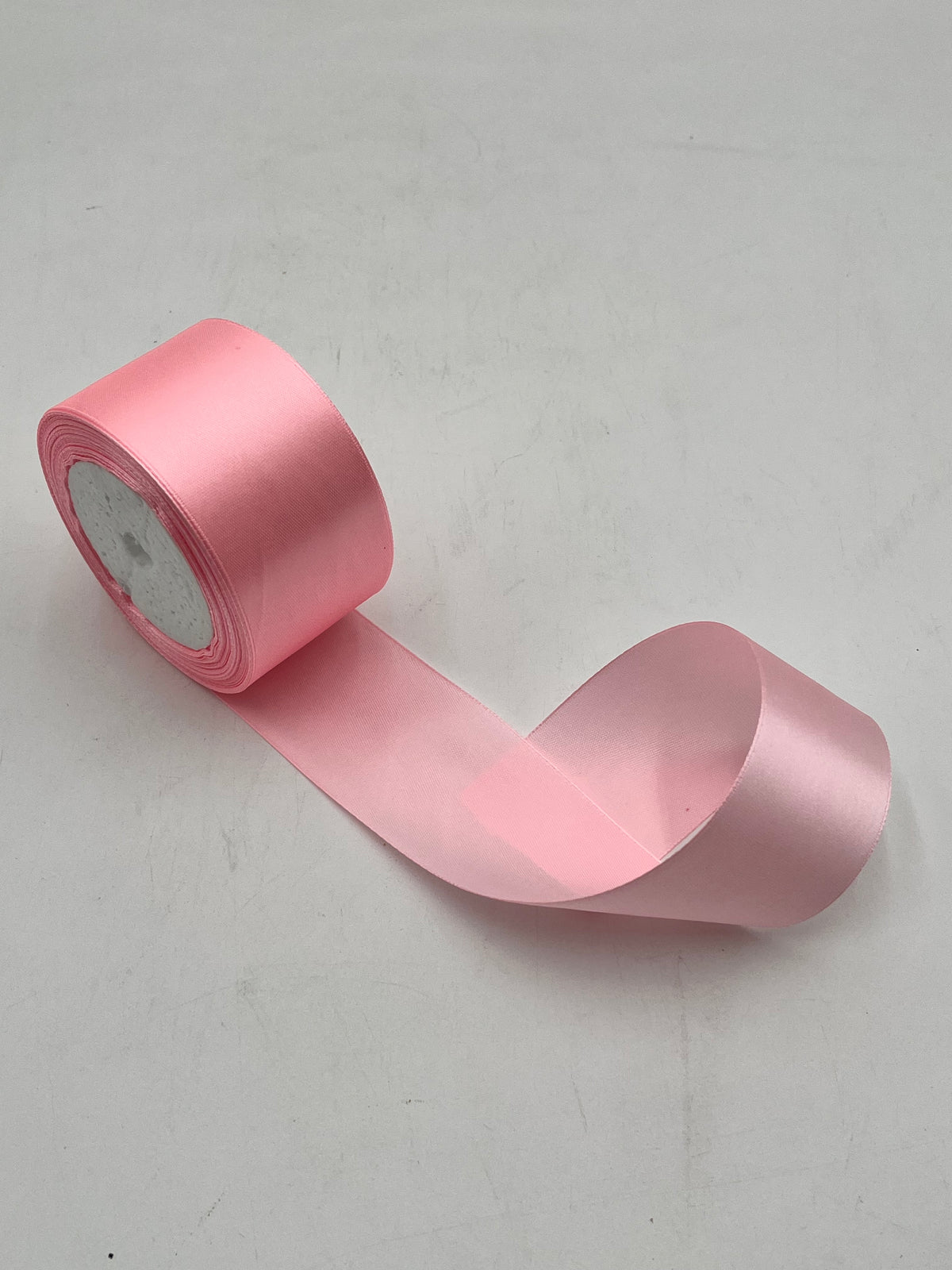 Satin ribbon rolls 1.5" & 2" x 25 yards in Red, Pink, White & Black. Sold individually or in packs by floralsuppliespoint1.com.
