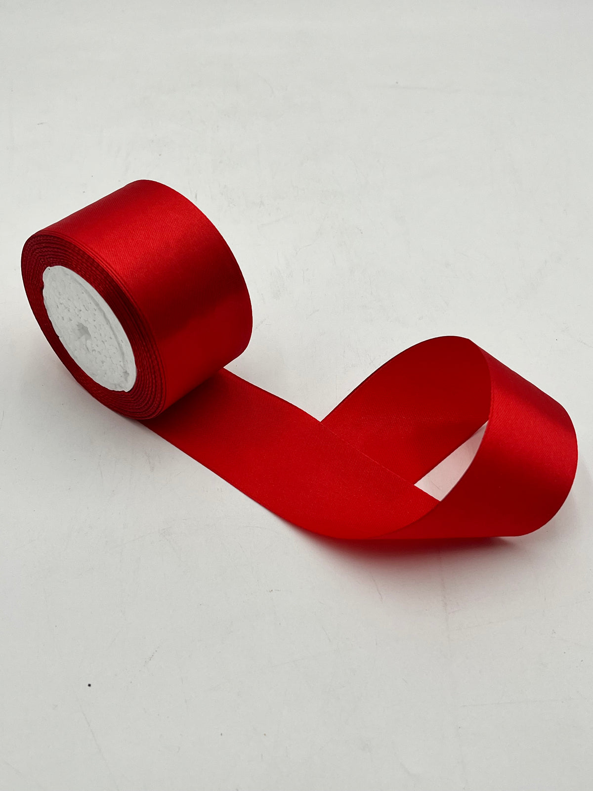 Satin ribbon rolls 1.5" & 2" x 25 yards in Red, Pink, White & Black. Sold individually or in packs by floralsuppliespoint1.com.