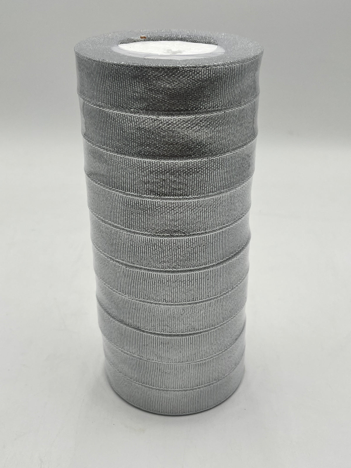 Silver polyester ribbon rolls in 1” x 25 yards, ideal for floral design, gifts and crafts. Pack of 10 sold at wholesale price by floralsuppliespoint1.com.