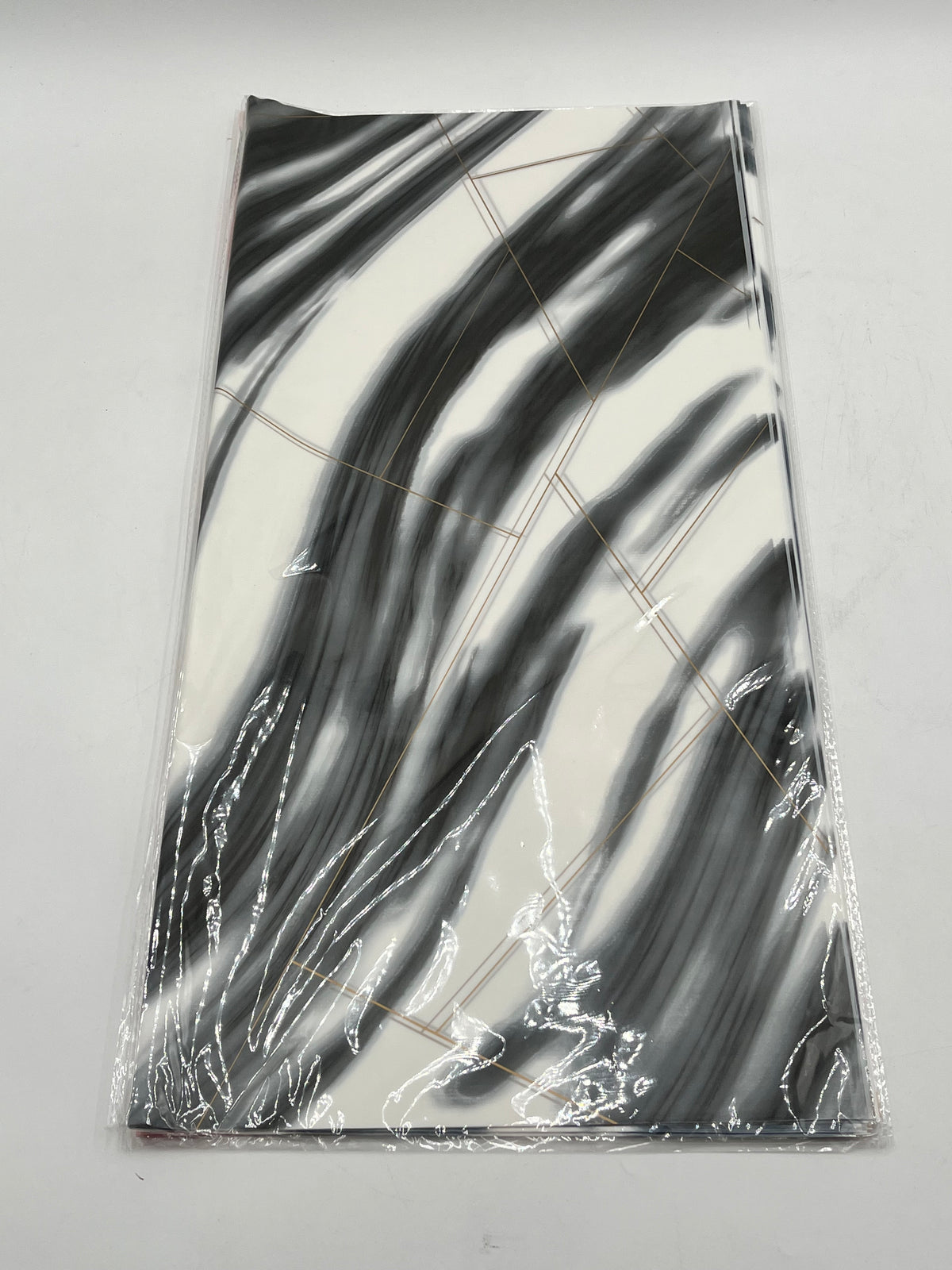 Wrapping sheets in Black marble swirl designs, 22x22 inch (20 sheets). Sold by floralsuppliespoint1.com for $9.99