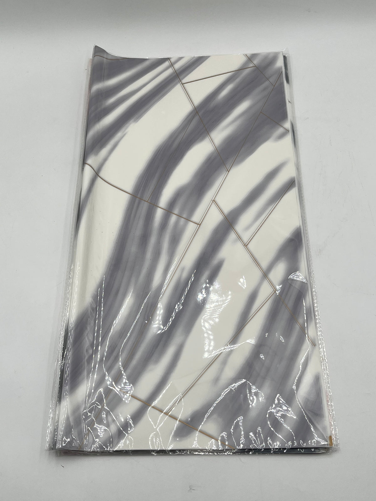 Wrapping sheets in Gray marble swirl designs, 22x22 inch (20 sheets). Sold by floralsuppliespoint1.com for $9.99