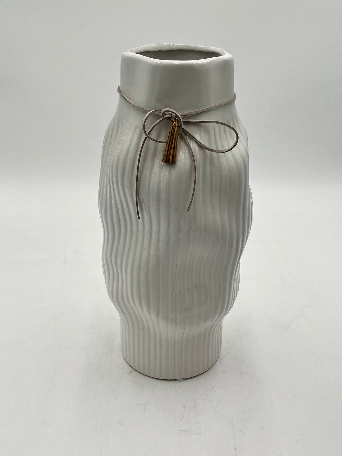 Modern & sophisticated 13"x3" ceramic vases with tassel detail in White. Sold by floralsuppliespoint1.com for $19.99 each