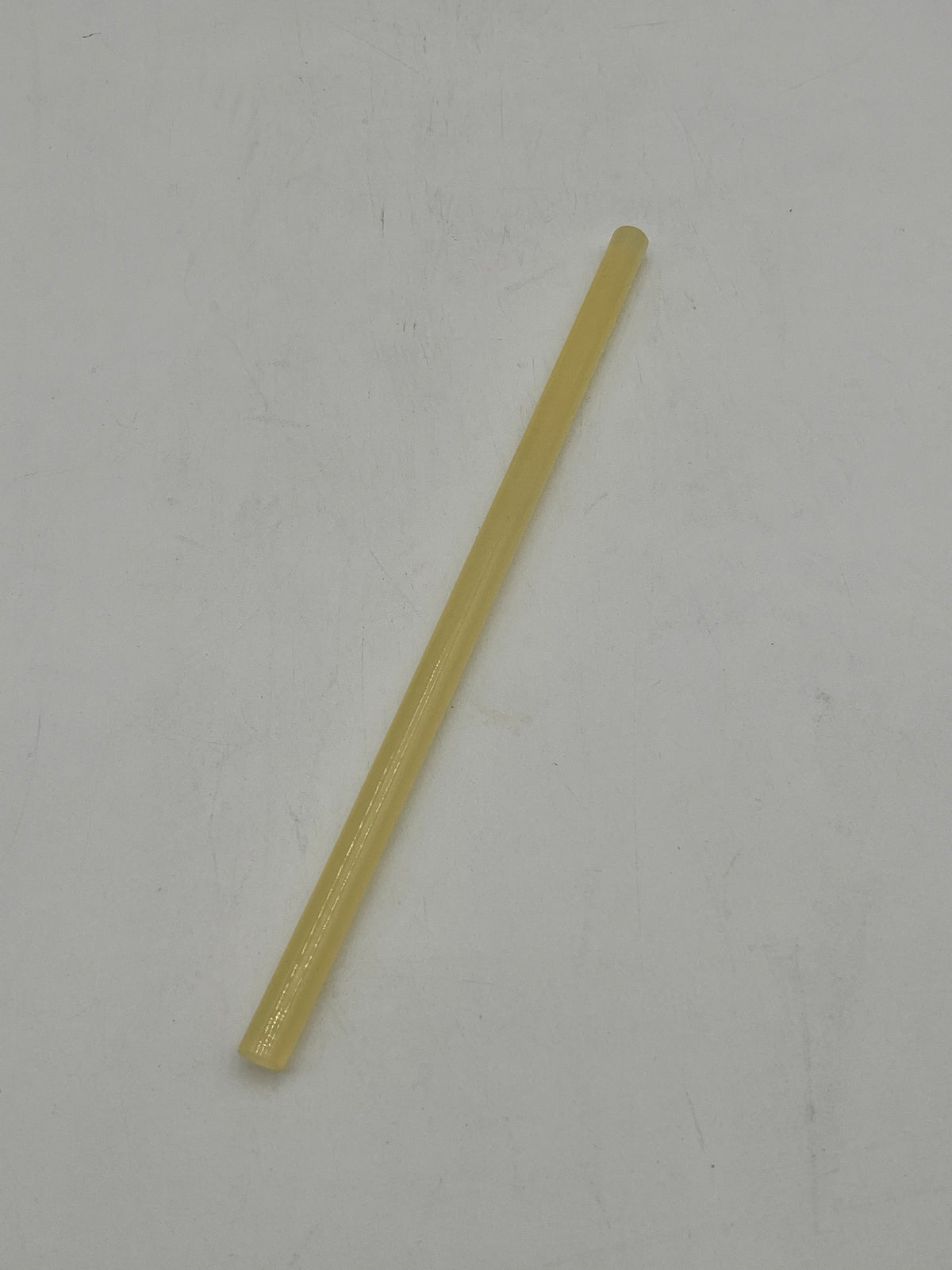 A yellow hot glue gun sticks for floral arrangements, crafts and DIY projects. Sold by floralsuppliespoint1.com