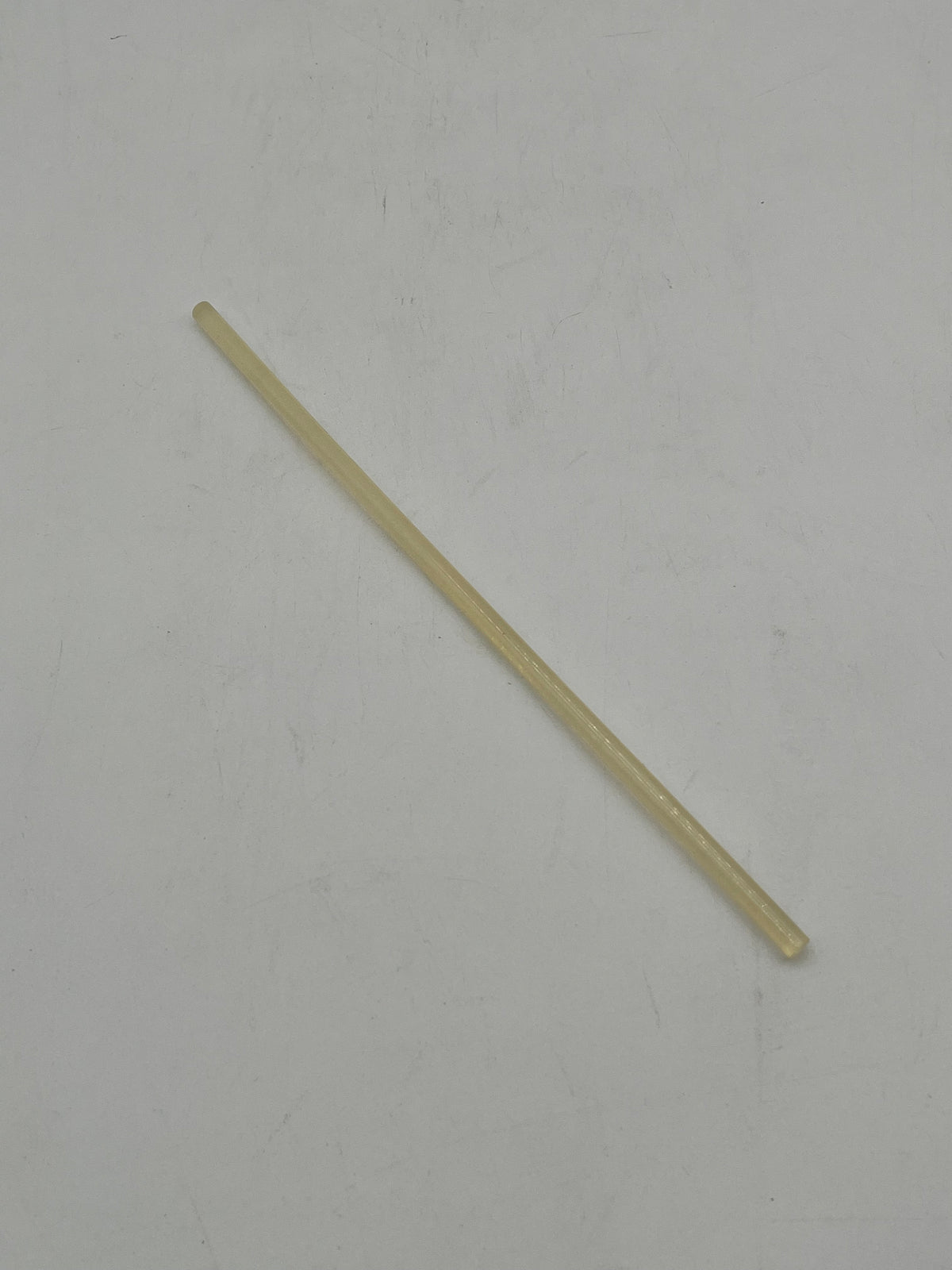 A yellow hot glue gun stick for floral arrangements, crafts and DIY projects. Sold by floralsuppliespoint1.com.