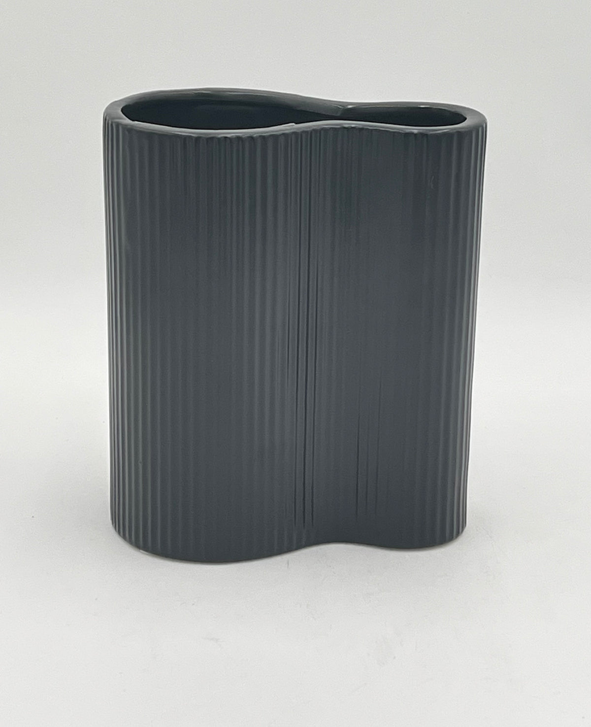 Twin Current vase in matte black with ribbed texture, sold by floralsuppliespoint1.com. Includes medium (8"x6") and small (6"x6") ceramic vases for modern floral designs.