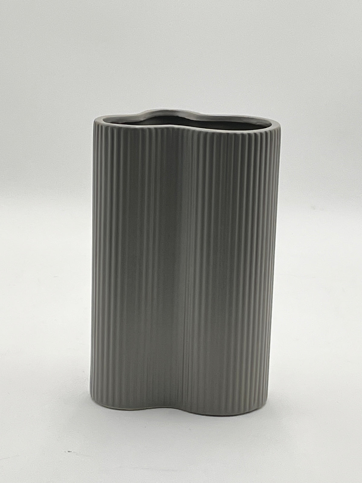 Waveline Core ceramic vase in Matte Grey with ribbed design, sold by floralsuppliespoint1.com. Each vase measures 9" x 5" and weighs 2.30 lbs, perfect for modern floral arrangements.