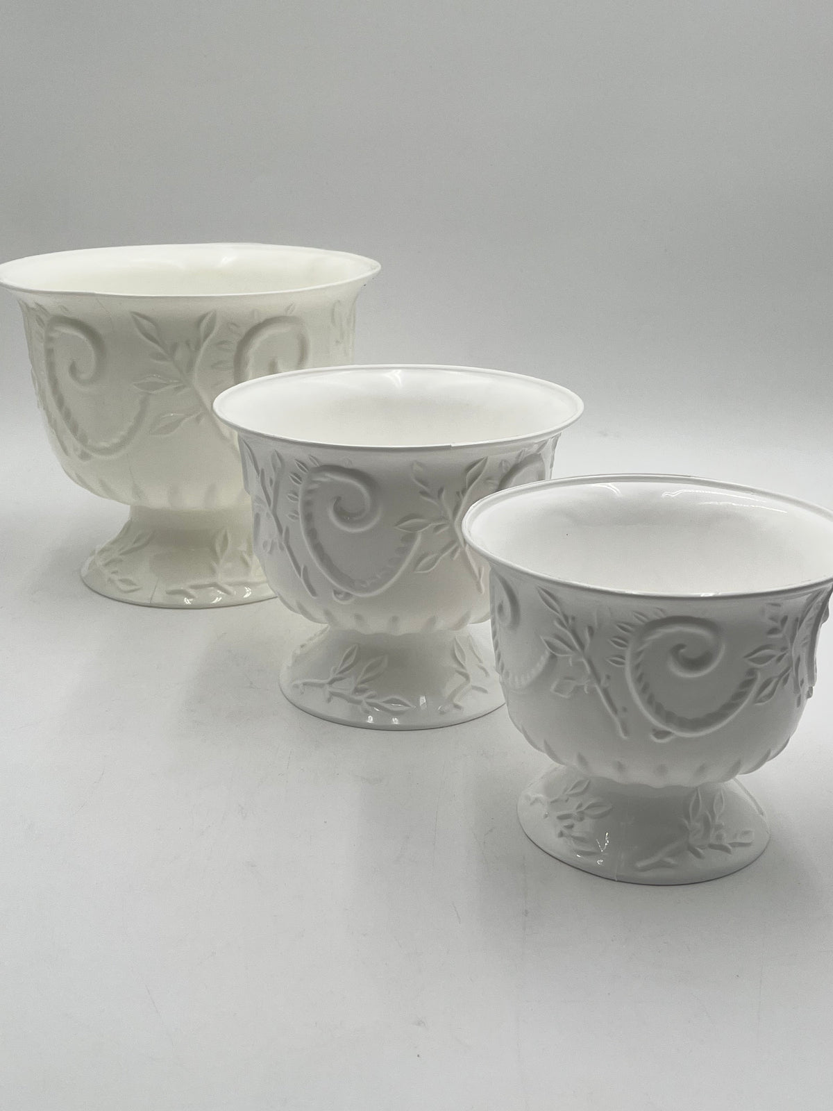 White Empress Urn Collection in 3 sizes. Elegant scrollwork pedestal urns for floral designs, décor, centerpieces or events- sold by floralsuppliespoint1.com