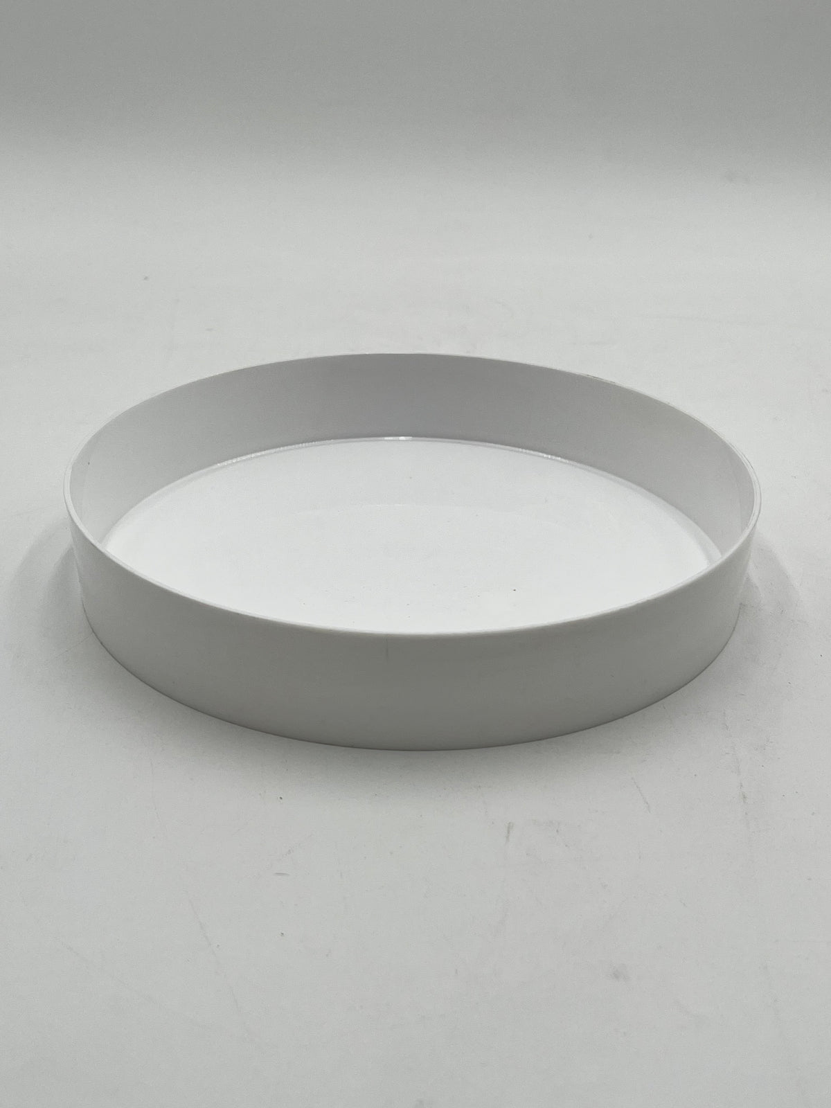 9” white round floral tray,1.5” deep. Perfect for foam-based fresh or artificial flowers. Durable, stylish and ideal for events. Sold by floralsuppliespoint1.com